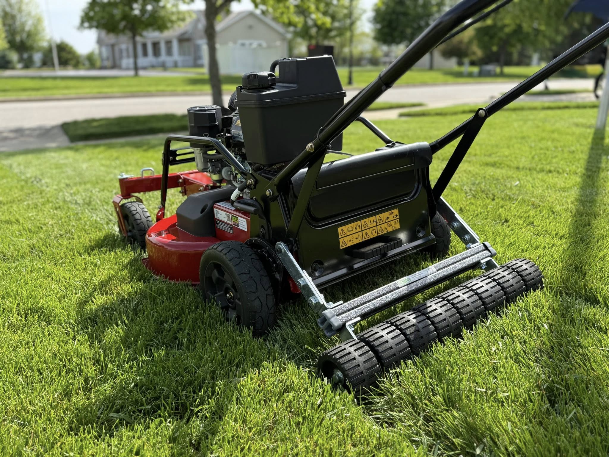 Push mower with a CheckMate lawn striper installed