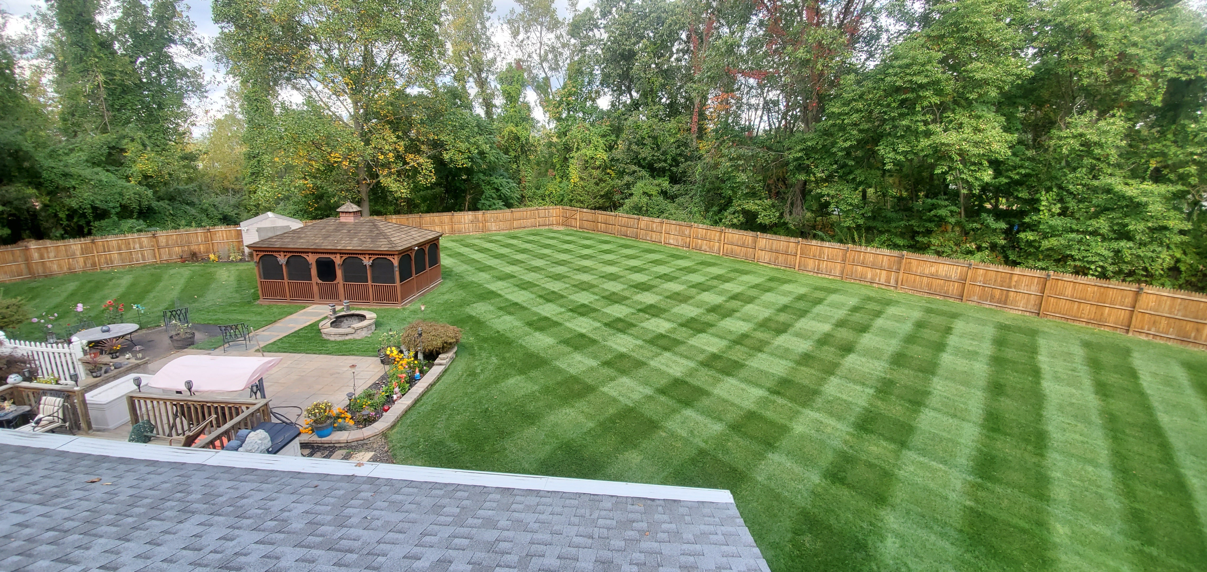 Striped lawn created with a CheckMate lawn striper