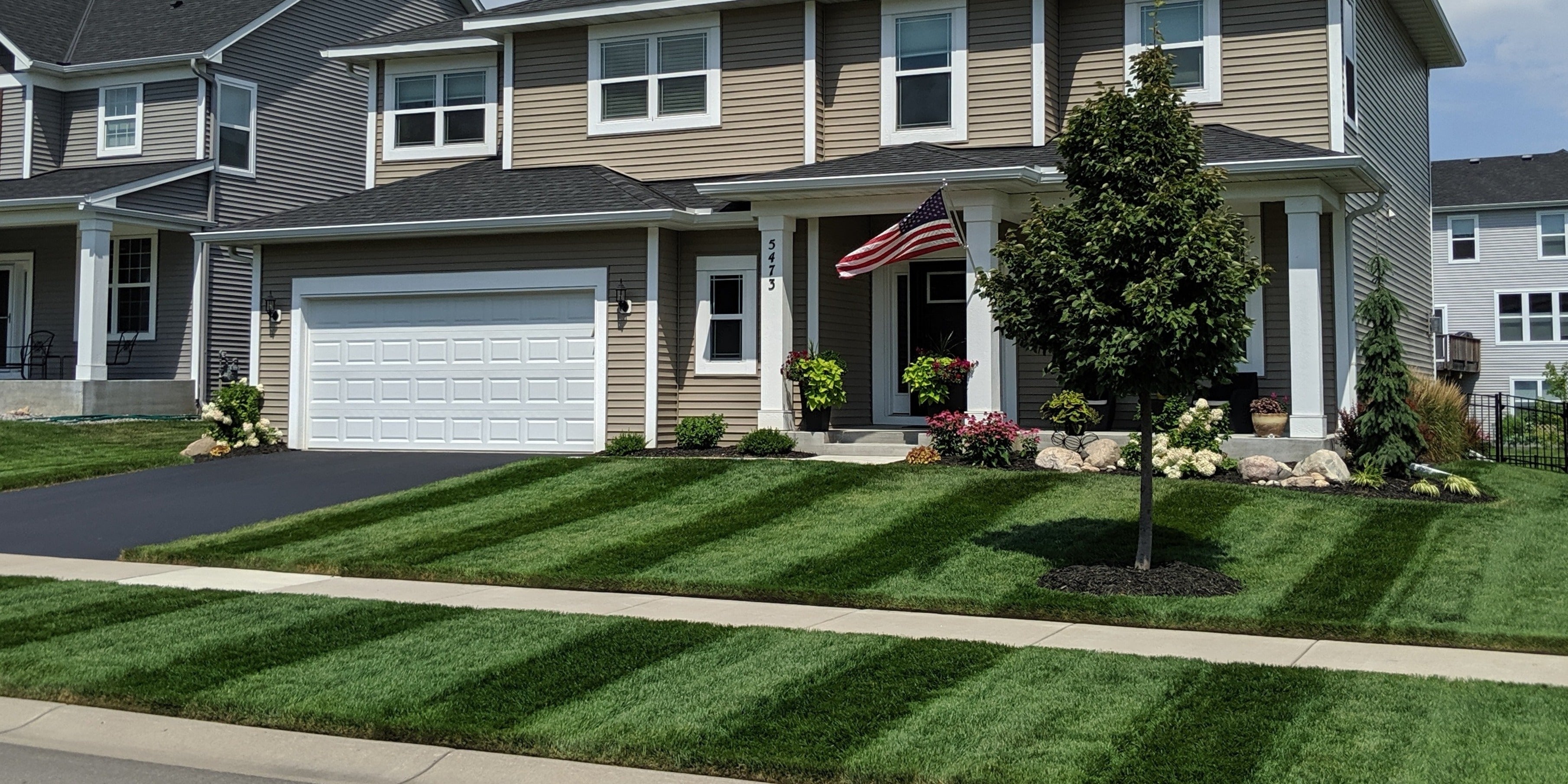Home surrounded by a professionally striped lawn