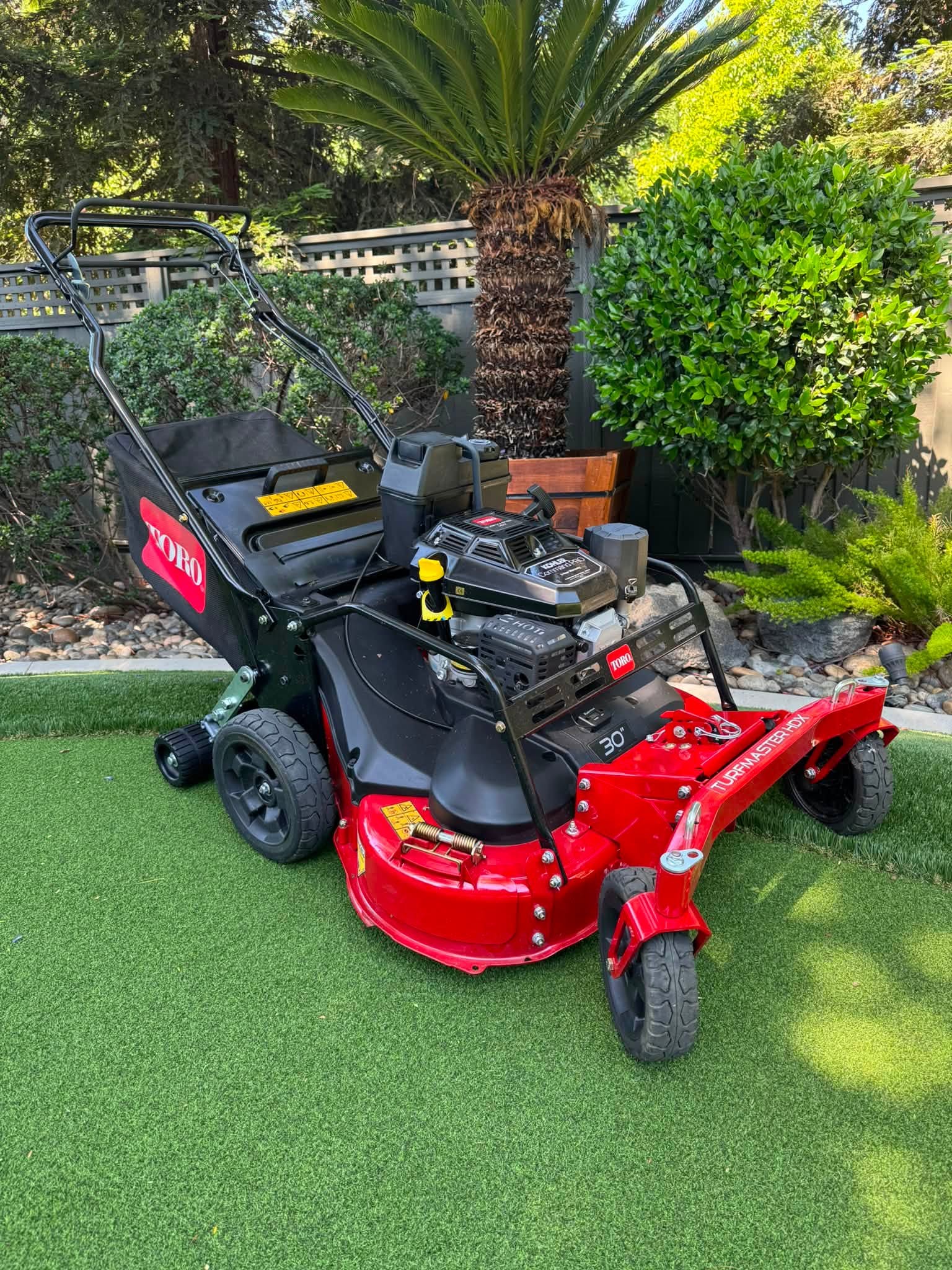 Toro TurfMaster HDX mower with a CheckMate lawn striping roller installed behind the rear wheels